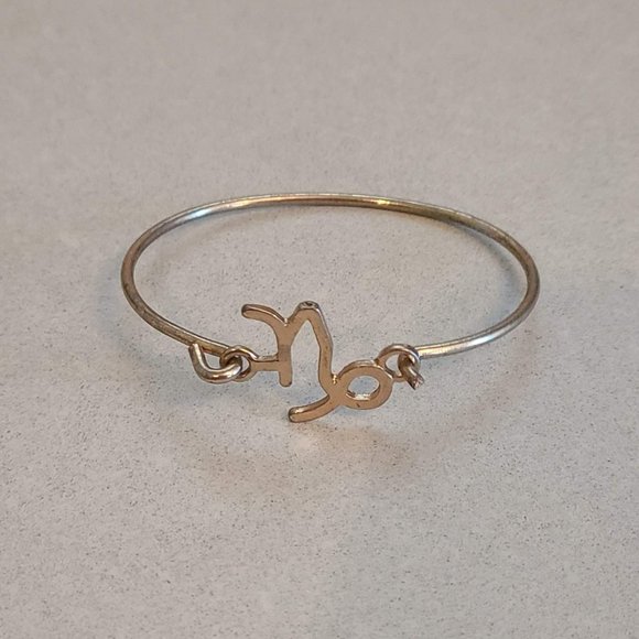 Gold Colored Bangle with Capricorn Symbol - Picture 1 of 6